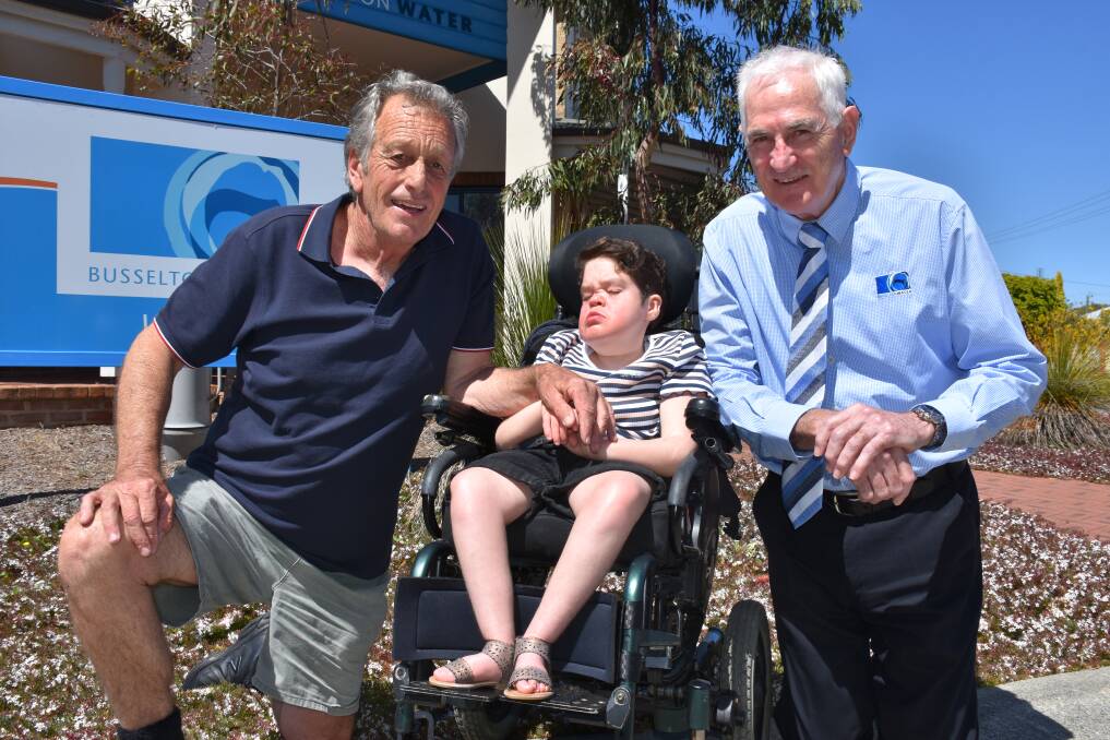 Disabled Surfer's Association South West president Ant Purcell with surfer Tahnee King and Busselton Water managing director Chris Elliott.