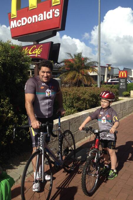 Busselton McDonald's owner John Frankham and Ethan Laura ahead of a ride from Busselton, which saw Ethan lead the group for seven kilometres out of Busselton.