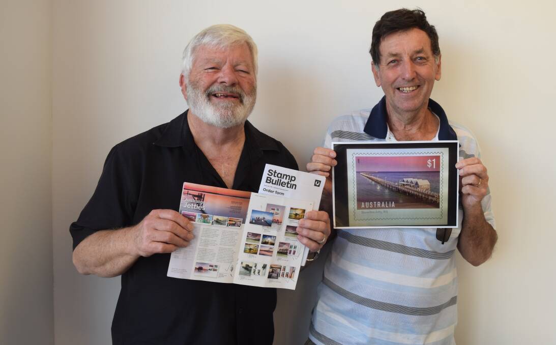Busselton Stamp Club member Neil Chaplin and president Tony West with an image of the Busselton Jetty stamp which will be issued on February 21. The club wrote to Australia Post two years ago suggesting the stamp.