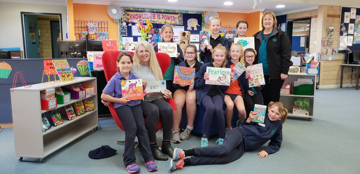 Geographe Primary School students with Dymocks Busselton owner Beth Herbert and the school’s library officer Carole Andrus. Image supplied.
