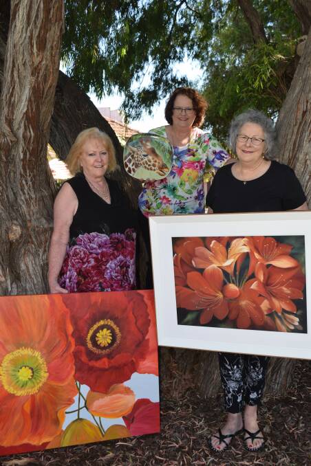 Busselton Art Society members Jill Evans, Carolyn Pollitt and Wendy Wicksteed with their entries for the 2019 Art in the Park.