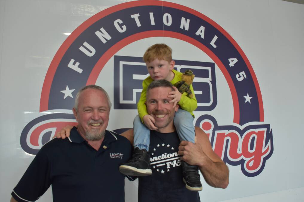Legacy Holiday Camp manager Steve Stoll, F45 owner Jason Ey and Archie.