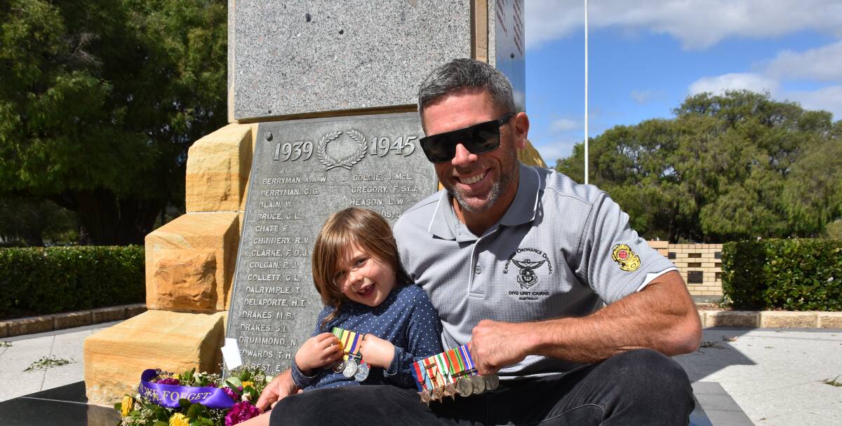 Busselton resident Jason Ey, pictured with his daughter Sydney, shares his experience of his time in the Royal Australian Navy where he served as a clearance diver for 10 years.