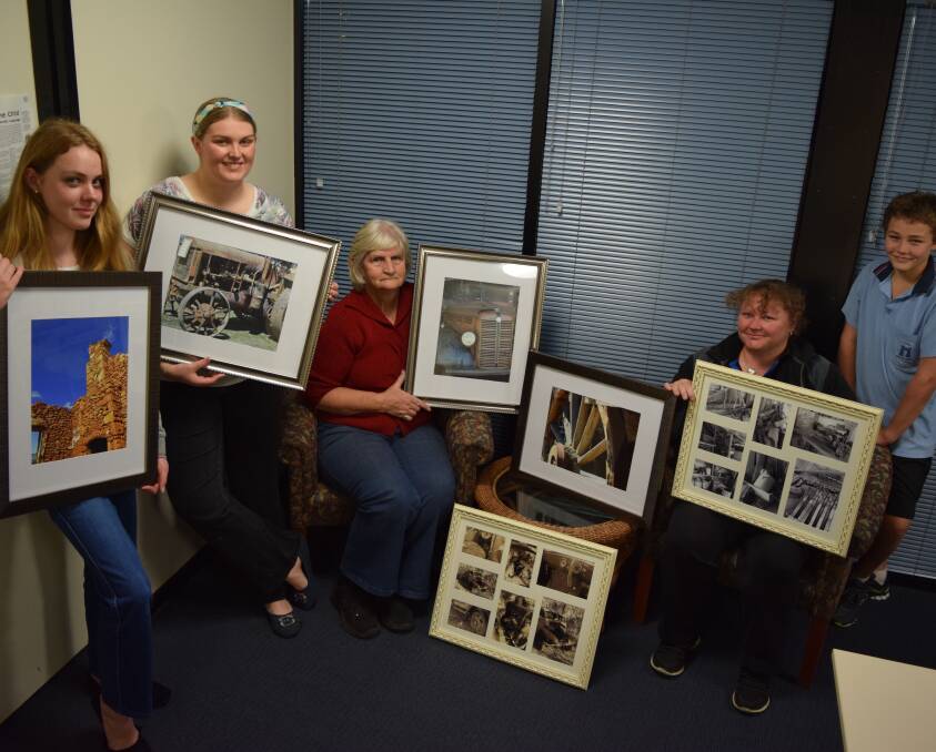 Happy snappers group: Members of the Wellington District Camera Group with some of the photos that will be on sale at their first exhibition at the upcoming Show and Shine event in September. 