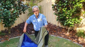 SLEEPING ROUGH: Rotarian Ross Johnston with a shelterbag. Picture: Supplied.