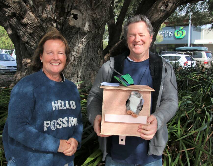 TAKING ACTION: Possum box winner Steve receives his prize from Nicole Lincoln. Picture: Supplied.