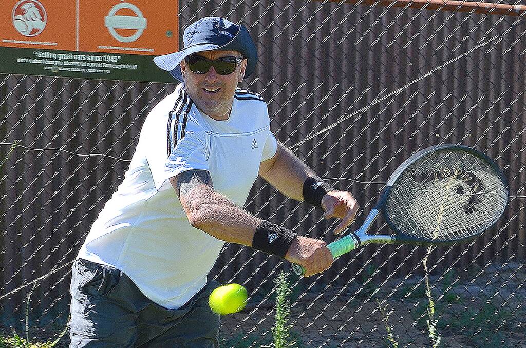 Andrew O’Neill lines up a backhand in his win in the Men’s Handicap Singles match. Photo: Jeremy Williams
