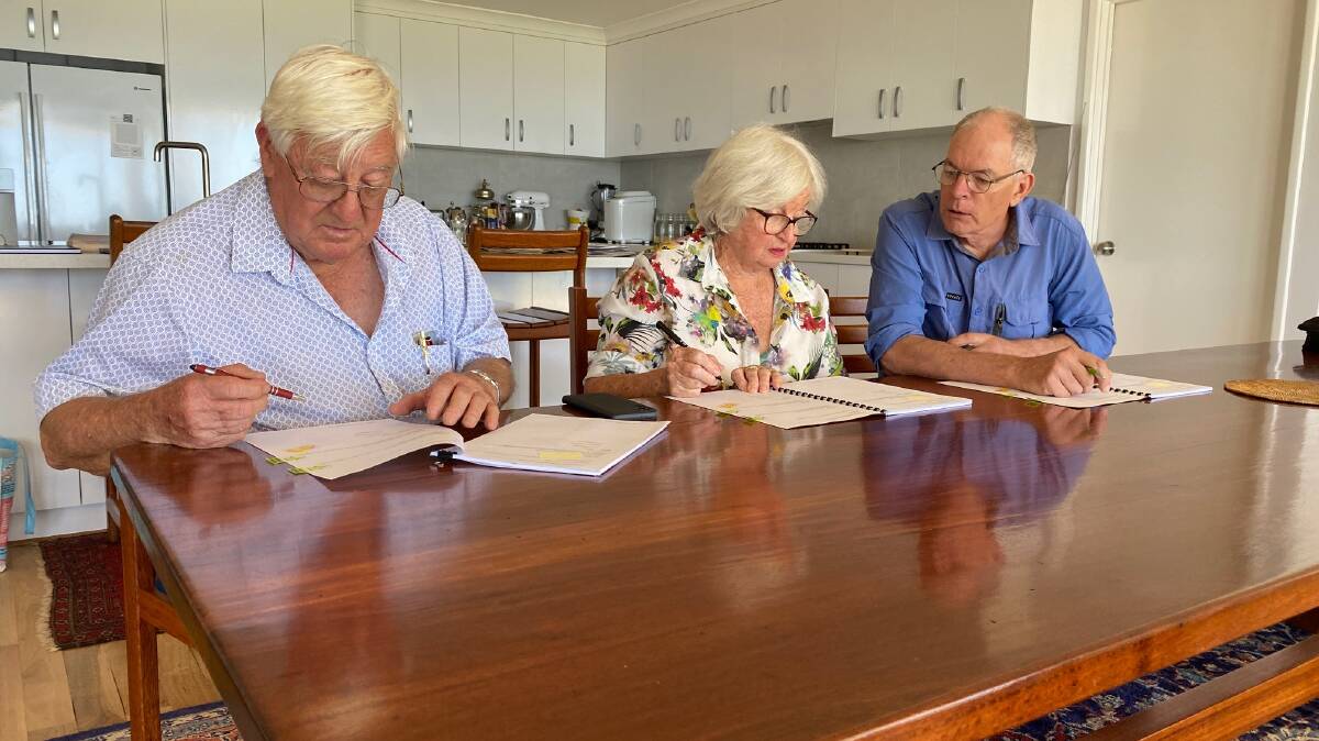 Signing: Ludlow Tuart Forest Restoration Group president Des Donnelly, committee member Evelyn Taylor and secretary Bill Biggins. Picture: Supplied.