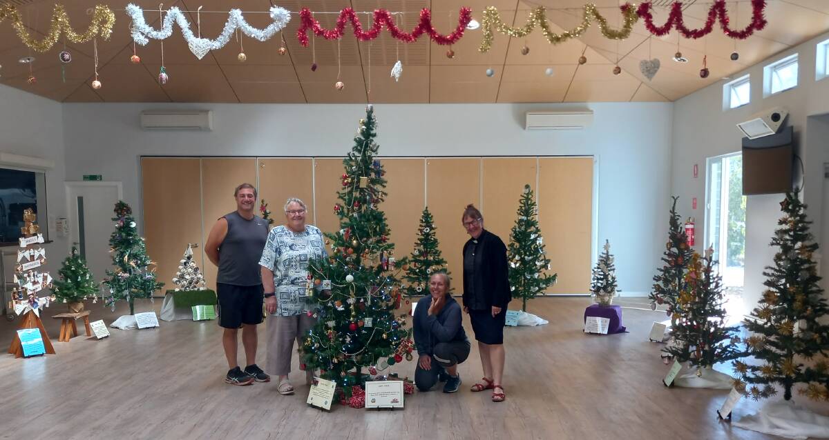 A thoughtful effort: Christmas-lovers Fay and Adrian worked together with Rev'd Lucy to bring the tree display to Dunsborough.