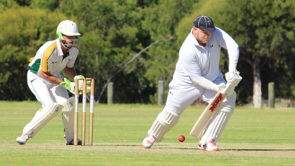 Ben Christmas shows a good defence for Dunsborough in A-Grade cricket on Saturday. The wicketkeeper is Shane Joyce.  Photo by Vanessa Hatton.