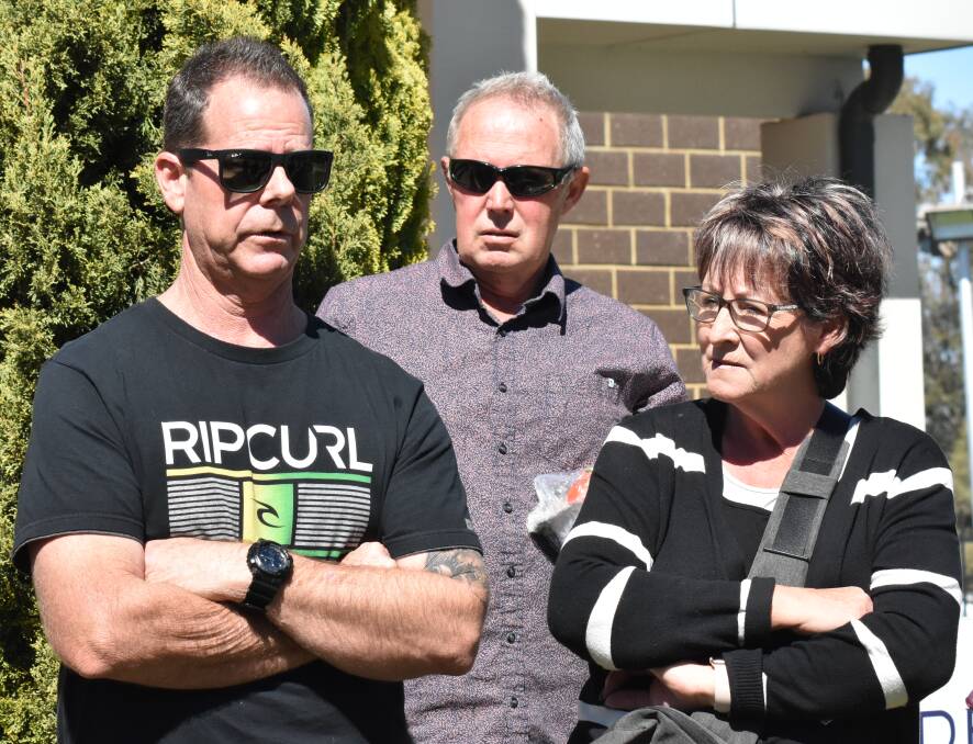 Disgruntled customer Chris Kindness (left) discusses his experience with fellow affected buyers at Saturday's meeting in South Yunderup. Photo: Kaylee Meerton.