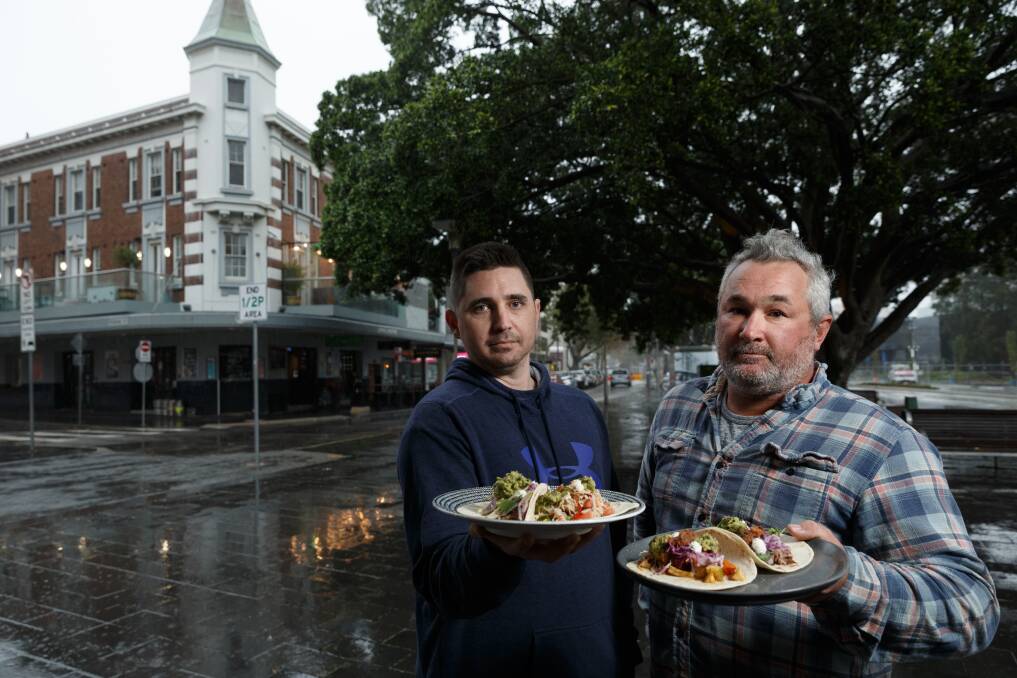 NO USE: Co-owners Mark Chegwidden and Tom Brown with a selection of their $2 tacos on Tuesday at The Crown & Anchor Hotel, which got a letter from Salsas for using their trade mark 'Taco Tuesday'. Picture: Max Mason-Hubers