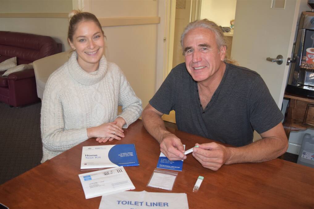 Cancer Council WA South West regional education officer Shenae Norris and Busselton resident Mike Jones with the testing kit. Image Sophie Elliott.
