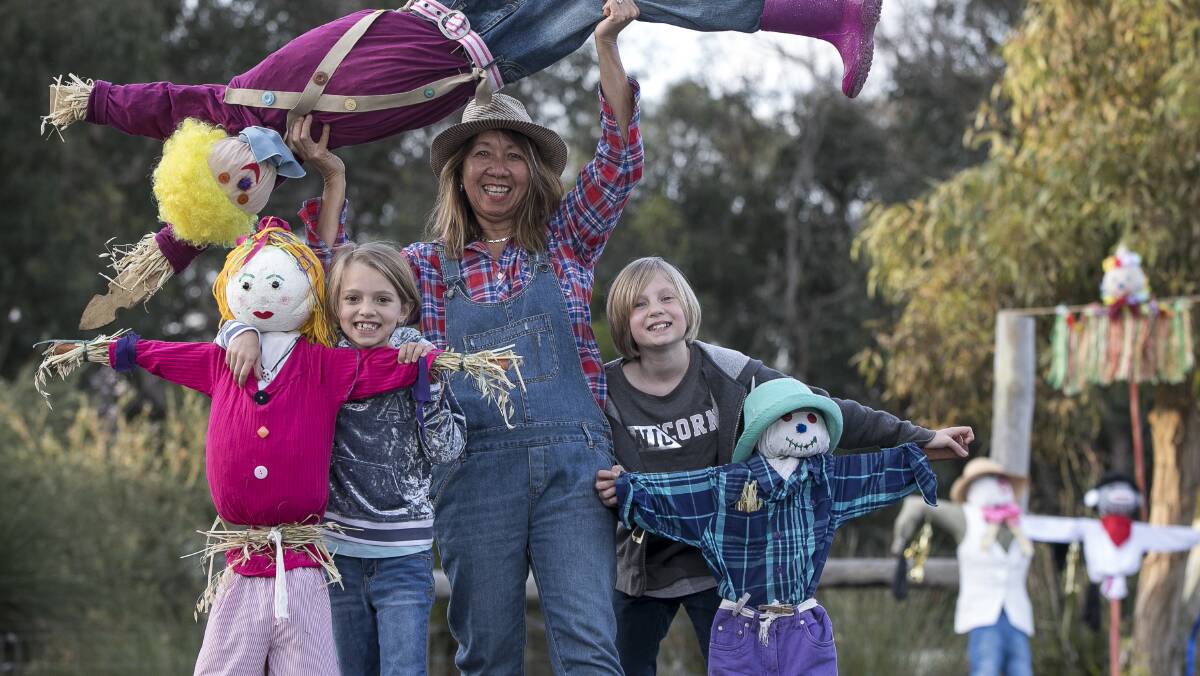 Nalia Williams and Chilali Williams with Shelley Acham of Lane Buck & Higgins with their scarecrow creations. Image Russell Barton.
