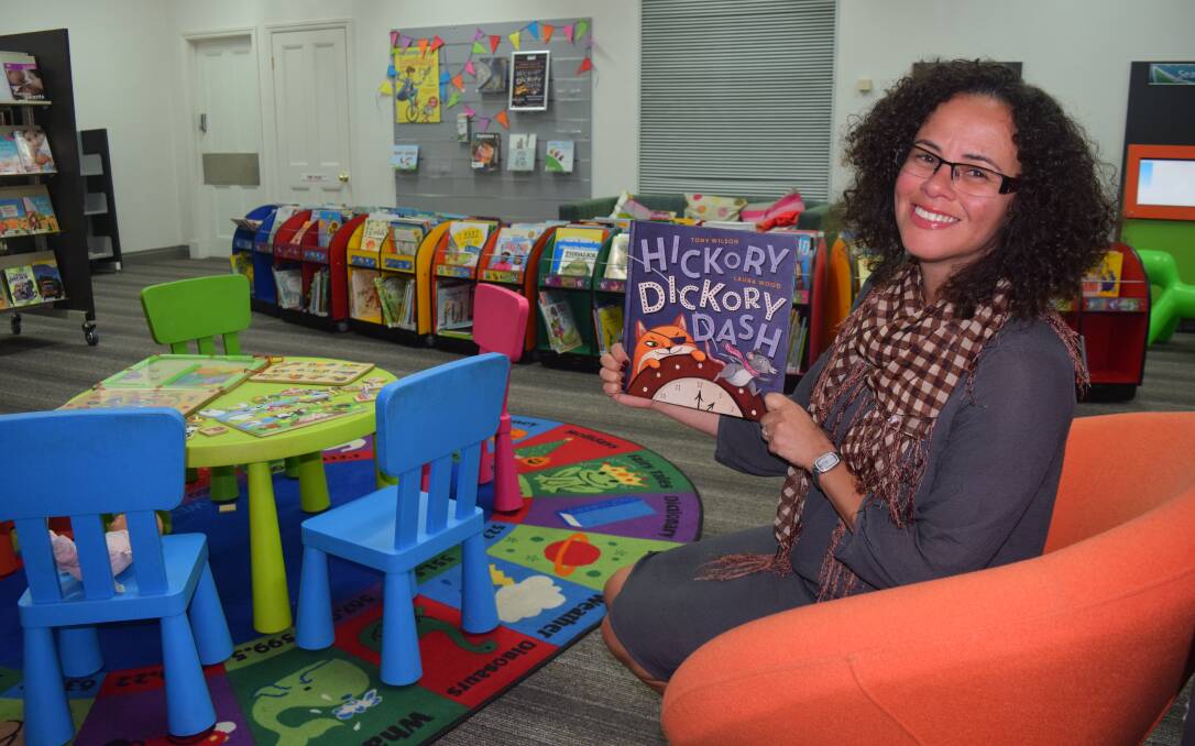 Busselton Libary librarian Ana Brawls with Hickory Dickory Dash, the book which will be read for the simultaneous storytime in Australia and New Zealand. Image Sophie Elliott.