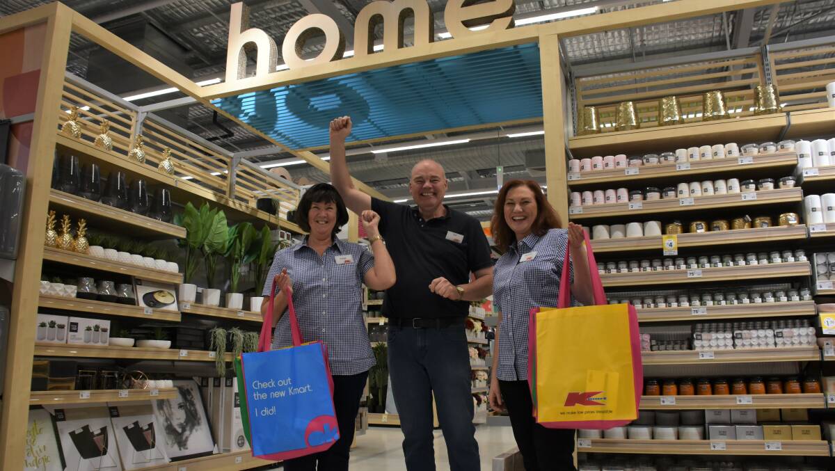 Kmart Busselton team members Diane Marshall and Natasha Passmore, with store manager Ted Carter, can't contain their excitement ahead of the store's opening on Thursday.