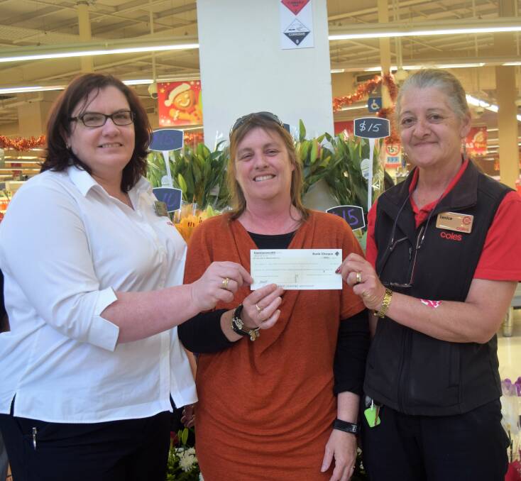 Coles Busselton store manager Karla Rees and Janice Pell present a cheque to Busselton Community Home Care operations manager Julie Cooper. Image Sophie Elliott