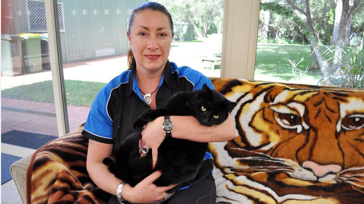 SAFE Busselton spokesperson, Lynda McKilligin, with her rescue-cat Alleycat, who was found in the LIA. Image supplied.