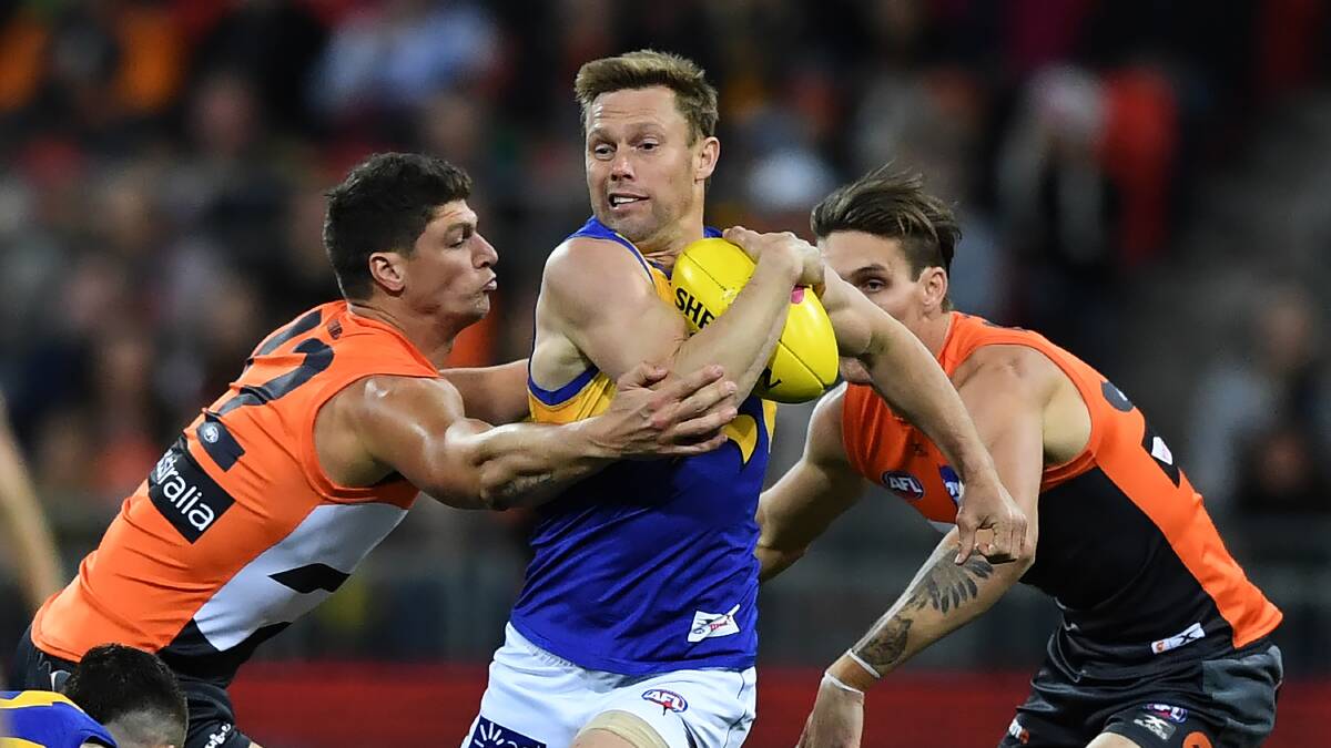 Midfield coach Sam Mitchell during his playing days with the West Coast Eagles in a game against the Giants.Image: David Moir/ AAP.