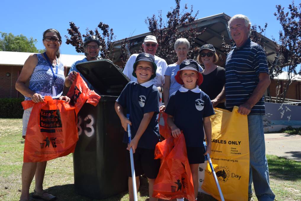 Dunsborough Primary School Year 3 students Henry Lipscombe and Corielle Eldridge with Dunsborough Clean Up Australia Day volunteers.