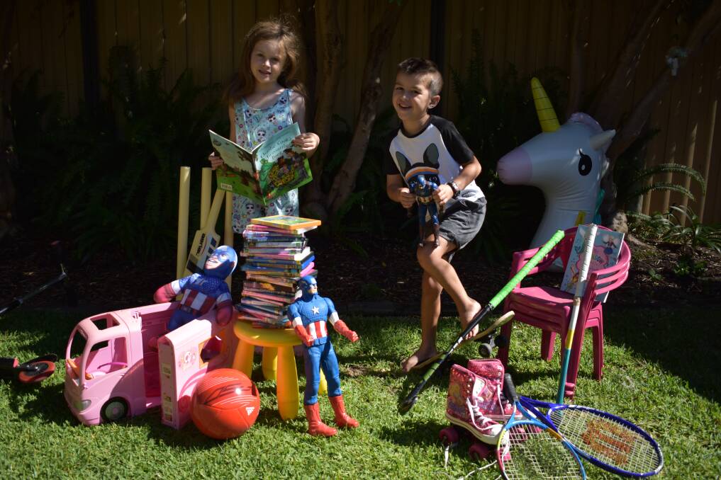 Busselton children Maggie and Jude sorting out items for the Summer Sellathon. Image supplied.