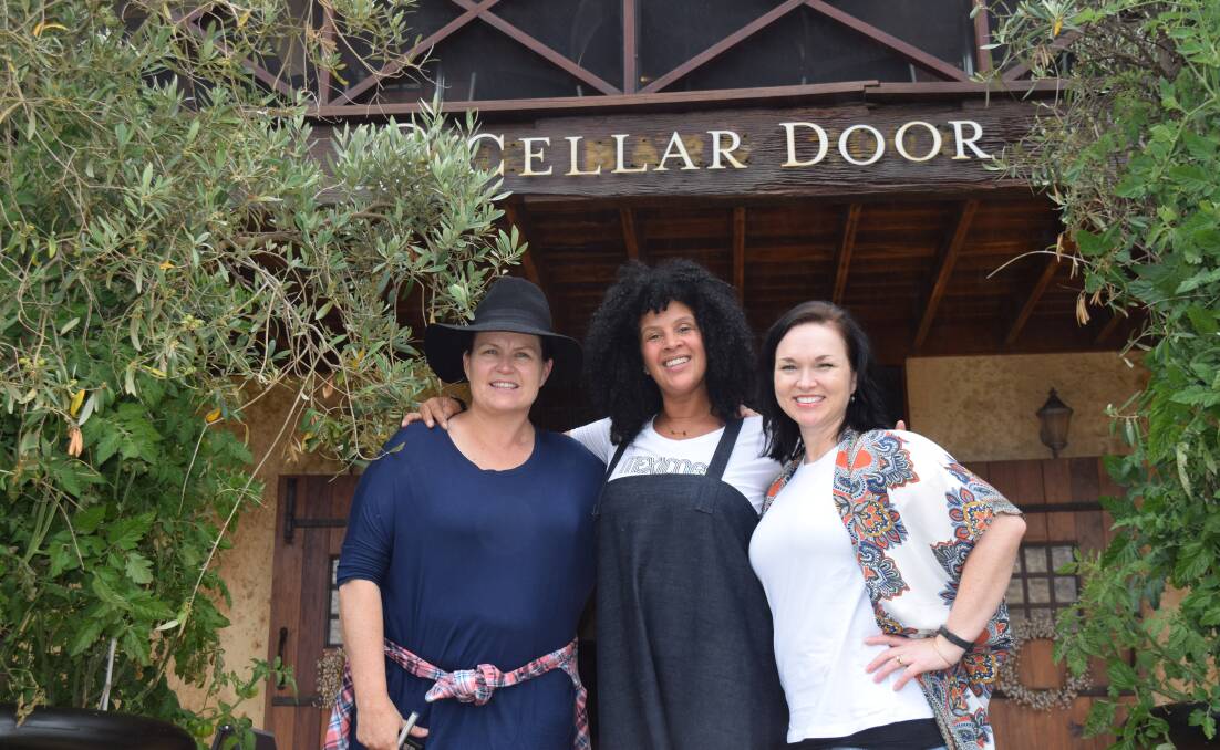 Artists Linley Molnar and Natalie Briney flank Creatives Collide curator, Kaye Guthrie Adonis, at Larry Cherubino Wines cellar door in Wilyabrup. Image Sophie Elliott.