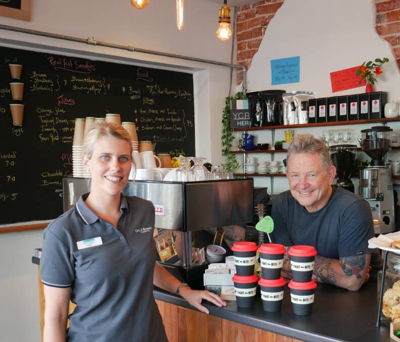 Environmental Health officer Phoebe Tucker with Bean & Gone café owner Roger Clark, who is showing support for the Fight the Bite message this summer. Image supplied.