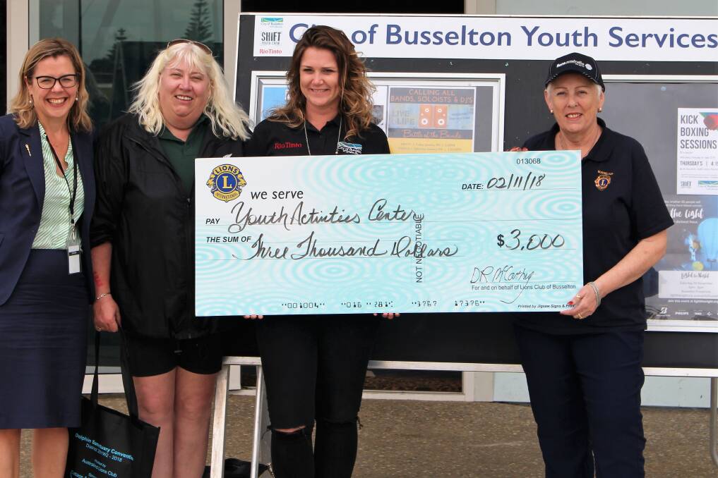 Busselton Lions' Beth Caunt and president Dawn McCarthy, pictured with Vasse MLA Libby Mettam, present a cheque to the city's youth development officer Angela Griffin.