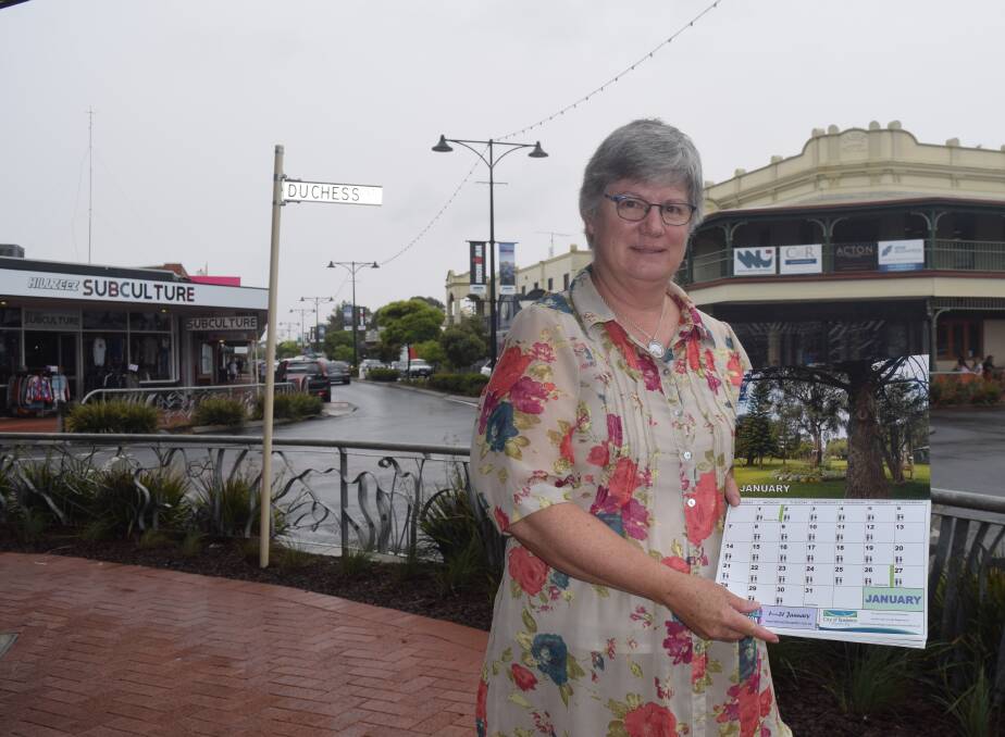 Louise Furniss with a special Busselton calendar created as a fundraiser for Living Foundation Zimbabwe. Image supplied.