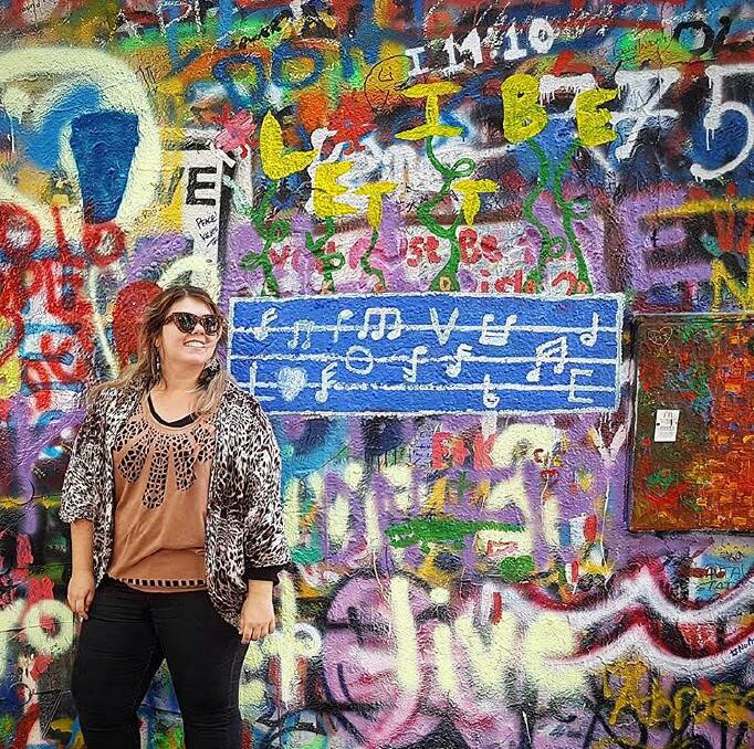 Sophie Elliott at the John Lennon Peace Wall in Prague.