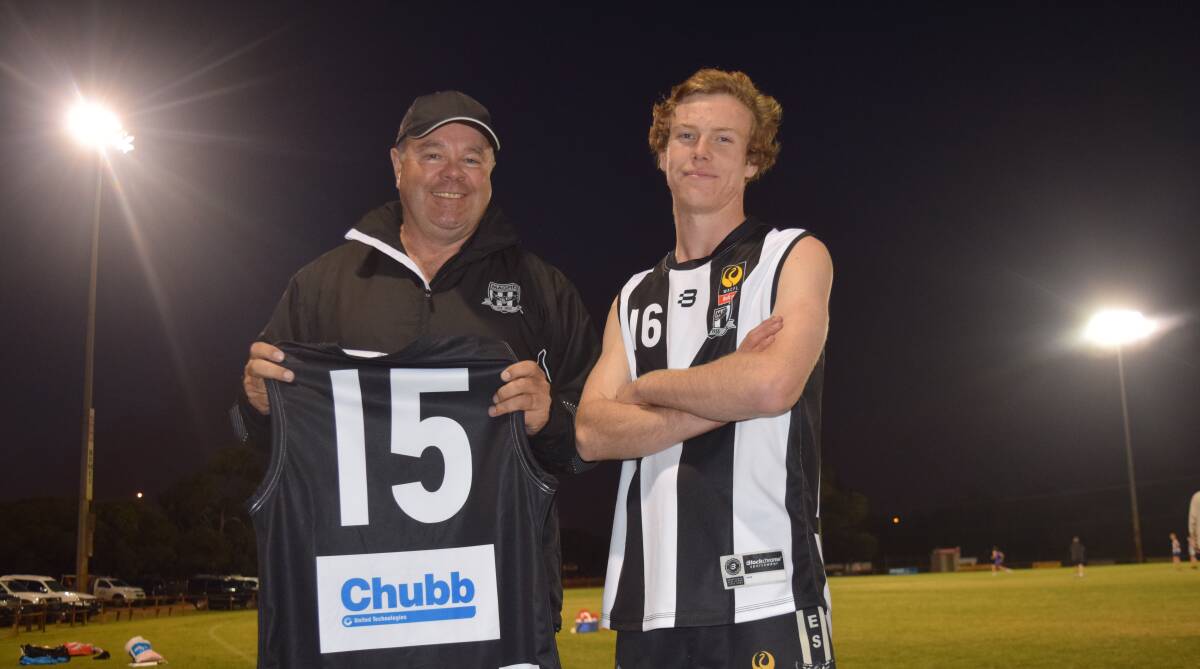 Busselton Football Club Colts coach David Lewis with vice captain Jayden Milner and their new Chubb Fire and Security South West jumpers. Image Sophie Elliott.
