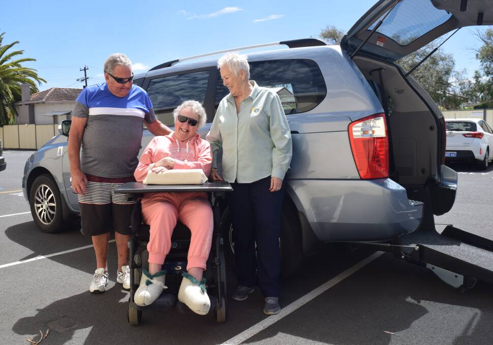 Peter and Chrissy Thompson with Busselton Lions Club president Dawn McCarthy and their donated Kia Carnival. Image Sophie Elliott.