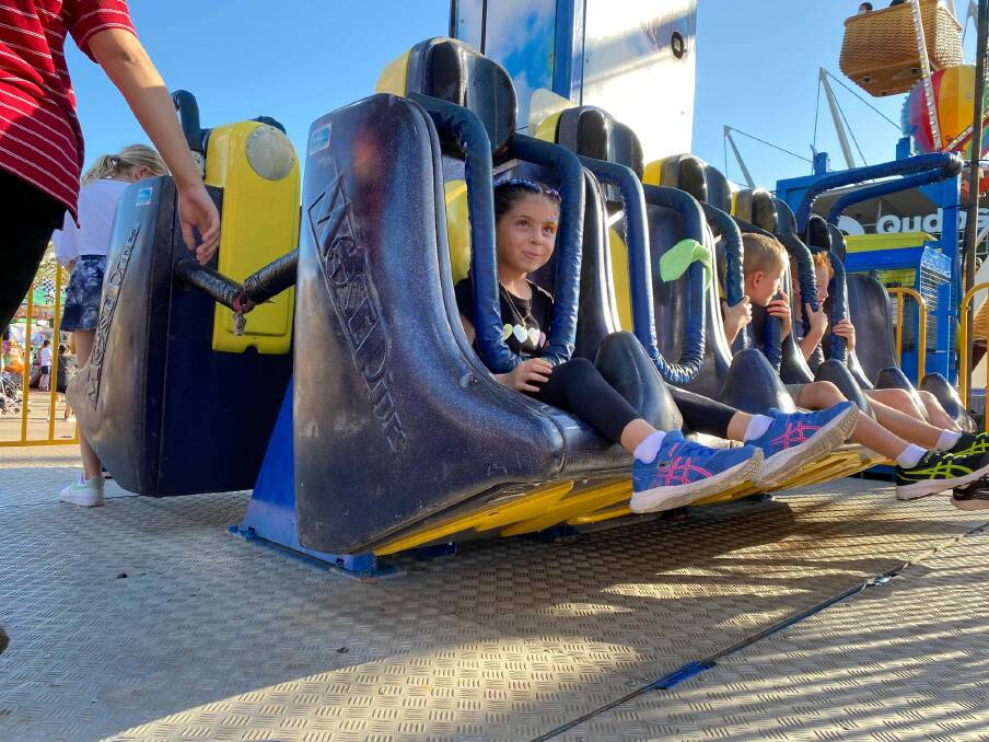 Ms Rubio supplied this photo of her dughter on the "Free Fall" ride at the Sydney Royal Easter Show. The photo was taken while the attendant (left) was helping the children to their seats.