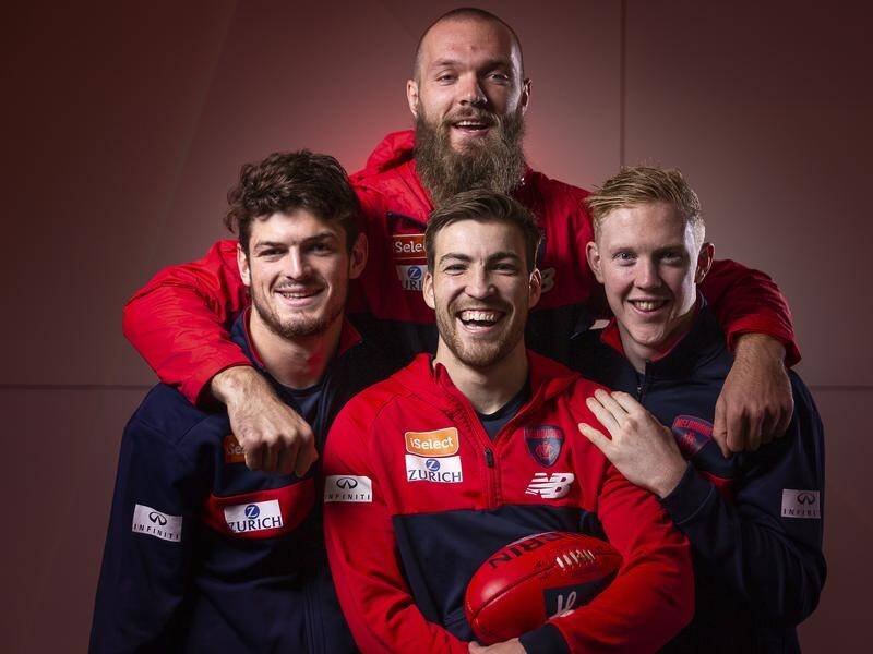 Angus Brayshaw (extreme left) says the Demons are thriving thanks to the brotherhood at the club.