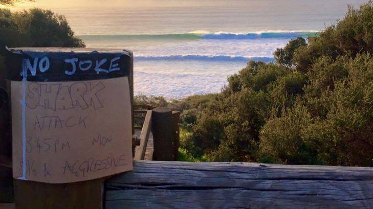 A homemade sign warning surfers of the shark attack on Monday at Indijup Beach, near Yallingup. Photo: Facebook/Luke Gerson