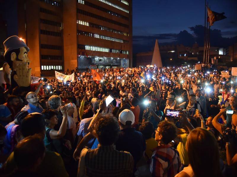 Hundreds of demonstrators in Bogota demand the resignation of Colombia's attorney general.