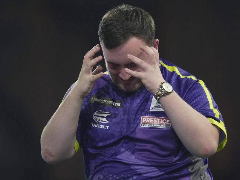 Luke Littler lost his battle with Michael van Gerwen after failing with two darts to hit double 10. (AP PHOTO)
