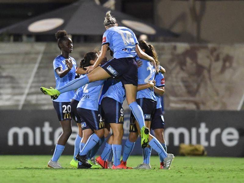 Sydney FC are through to the W-League grand final with a 2-1 win against the Roar in Brisbane.