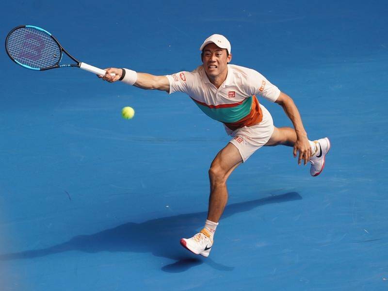 Kei Nishikori survied an Ivo Karlovic ace assault to make the third round of the Australian Open.