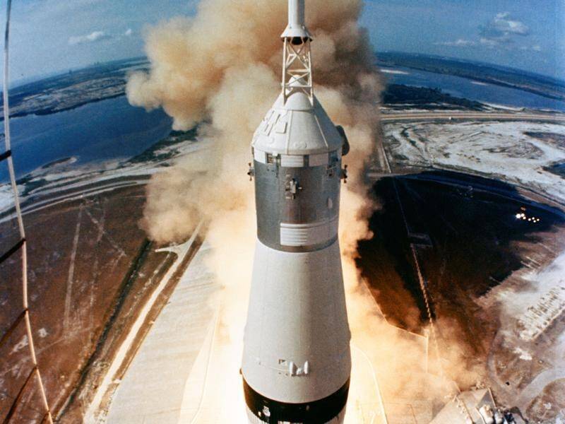 The Saturn V rocket carrying the Apollo 11 crew blasts off from Cape Canaveral on July 16, 1969.