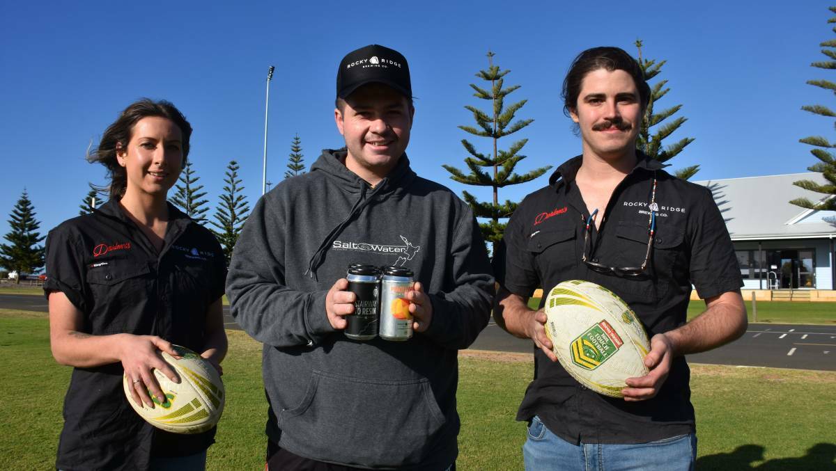 CAN'T TOUCH THIS: TJ and Liam, both from Darleen's, are standing either side of Busselton Touch Football Club's Tiarn Paulin. Photo: Emma Kirk