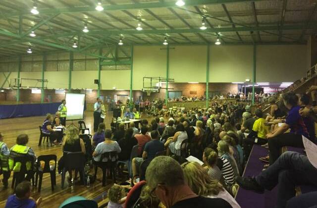 A meeting of about 300 people evacuated from the Waroona bushfire at Leschenault Leisure Centre. Photo: Chloerissa Eadie. 