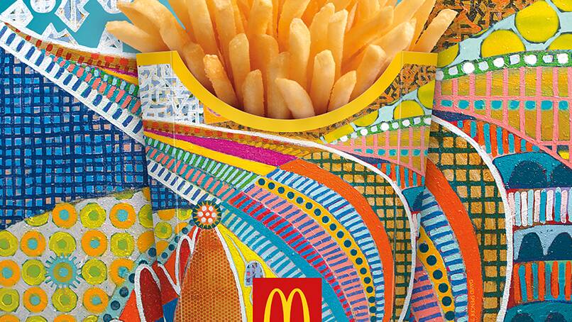 Mr Spencer's work gracing the iconic hot chip packaging. 