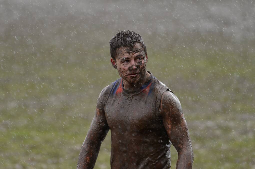 MUD BATH: The players were unrecognisable under layers of mud at Learmonth Oval near Ballarat on Saturday.