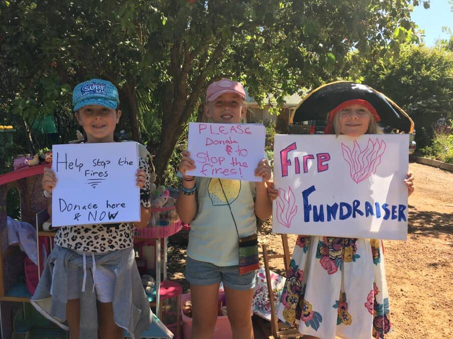 Ophelia, Eva and Meg held a toy sale and auction over the weekend to raise funds after Meg devised the plan to help the bushfire appeal. Photos: Victoria McKenzie