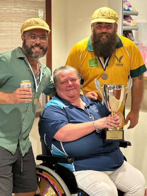 Margaret River Hawks A-Grade skipper Jack Green, left, with club President Elle Weston, committee member Danny Weston and the T20 championship trophy.