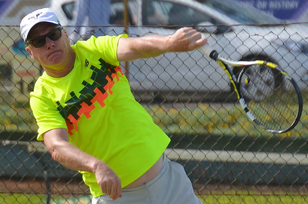 Jim Creedon seriously hammers down a serve. Photo supplied.