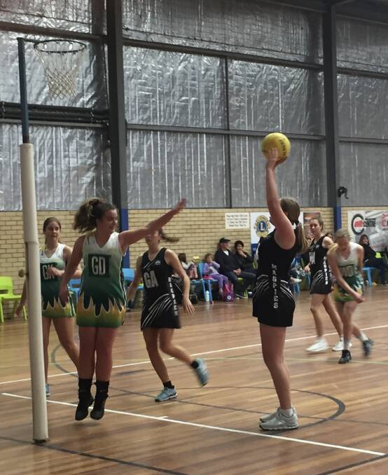 Swooping to victory: Magpies 18s Matilda Cann putting another shot away. Photo: supplied.