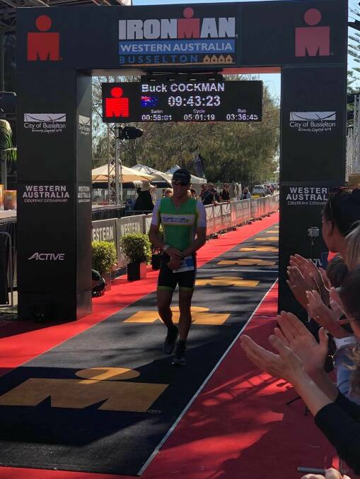 World-class: Buck Cockman crossing the line at Busselton Ironman. Photo: supplied.