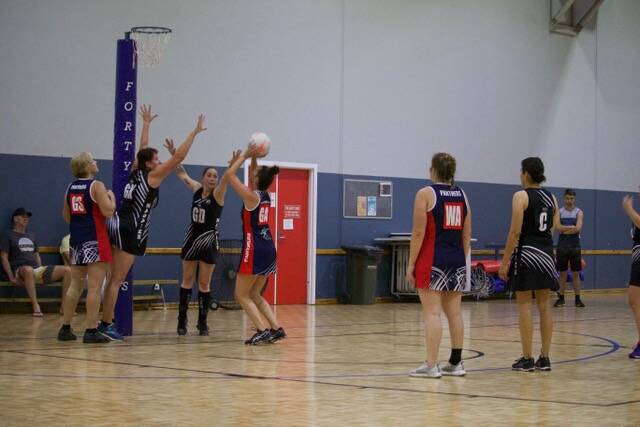 Good defence: Magpies Masters with Carol Hayley and Nichole Gleed defending the shot. Photo: Supplied.